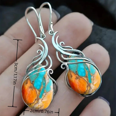 Pendientes colgantes con piedras preciosas azules y naranjas brillantes