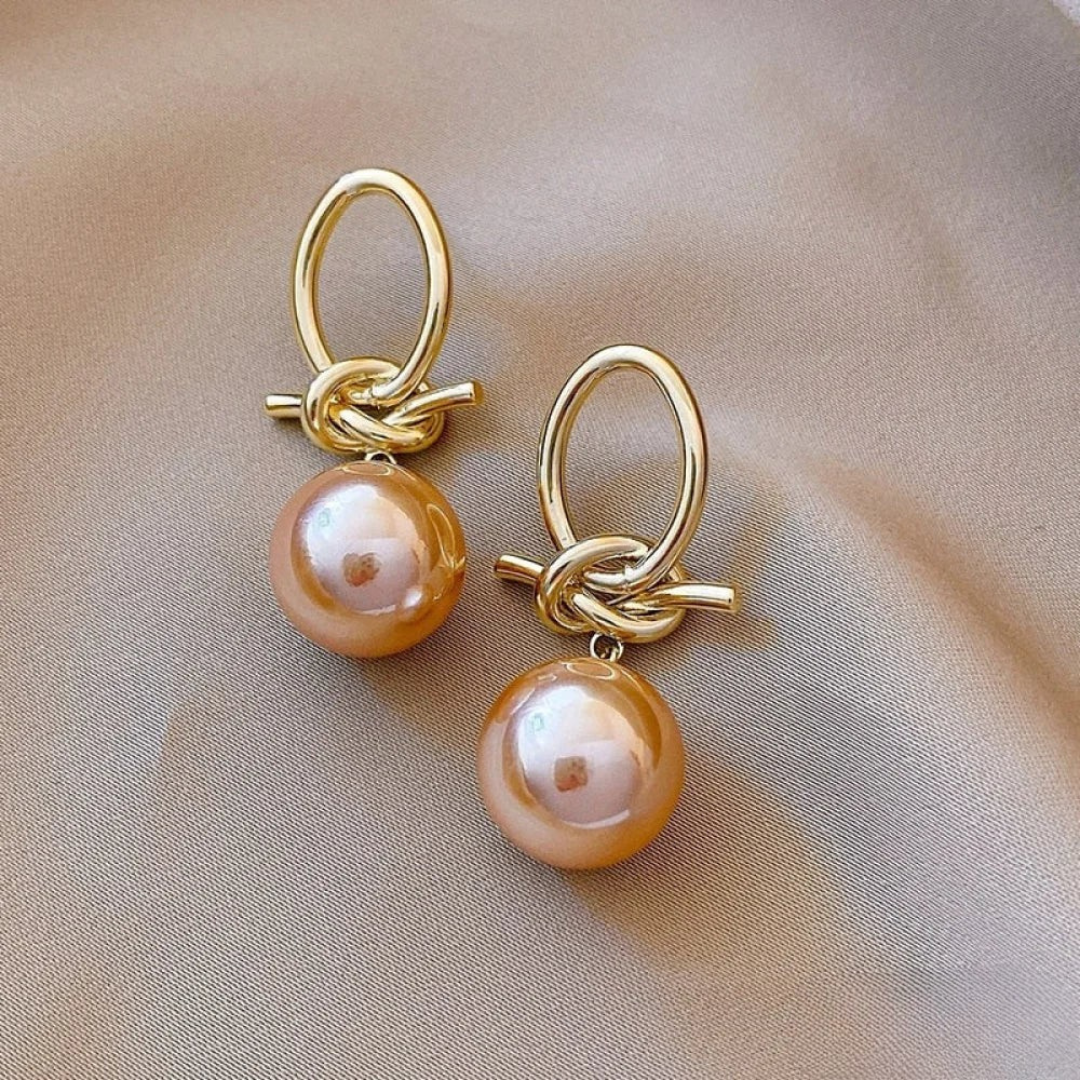 Elegantes pendientes colgantes de perlas rosas
