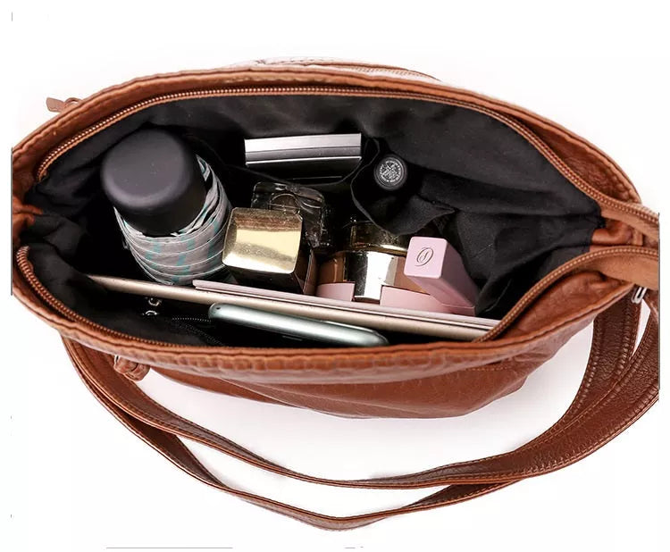 Diane - Bolso bandolera de piel con dije vintage