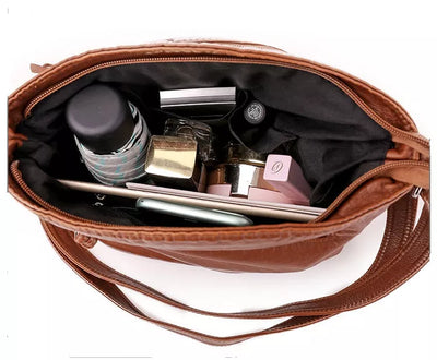 Diane - Bolso bandolera de piel con dije vintage