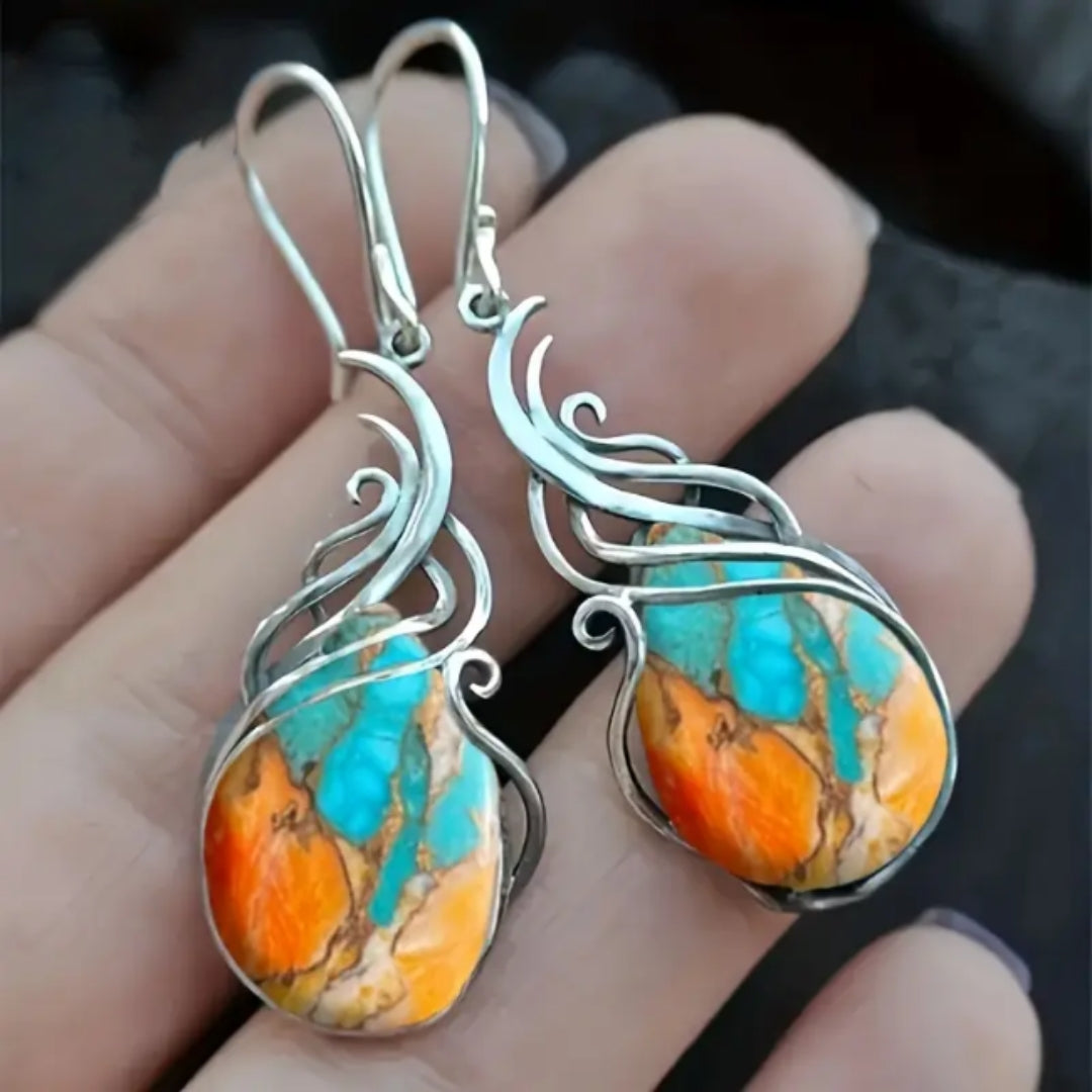 Pendientes colgantes con piedras preciosas azules y naranjas brillantes