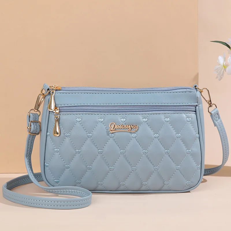 Lily - Bolso bandolera de piel con elegancia eterna 
