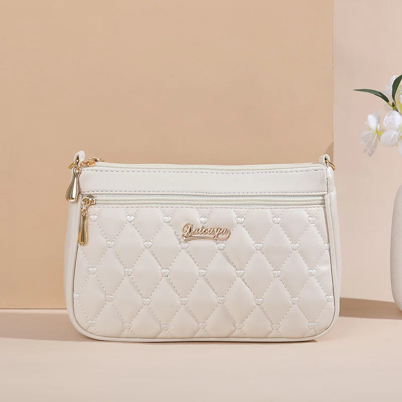Lily - Bolso bandolera de piel con elegancia eterna 