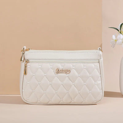 Lily - Bolso bandolera de piel con elegancia eterna 